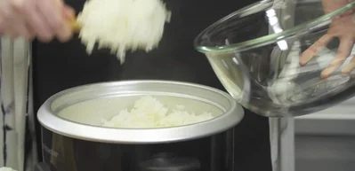 Prepare seasoned rice: Mix cooked rice with rice vinegar, water, sugar, and salt.