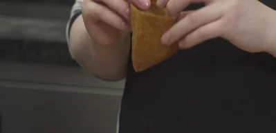 Make inari (fried tofu rice pockets): Gently open the pocket of fried tofu and fill with seasoned rice.