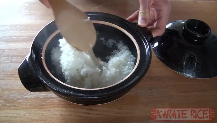 Fluff the rice with a fork or rice paddle.
