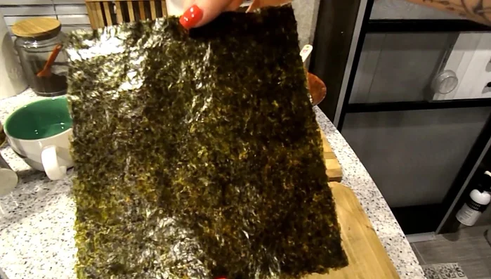 Lay the shiny side of the nori sheet face down.