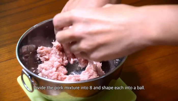 Divide the pork mixture into eight portions and shape each into a small bowl.