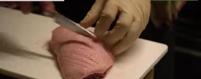 Prepare the duck breast. Make a cut in the skin to allow the fat to render more easily.
