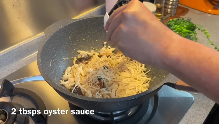 Add 2 tbsp oyster sauce, 2 tbsp light soy sauce, 1/2 tsp chicken stock powder, and mix well.