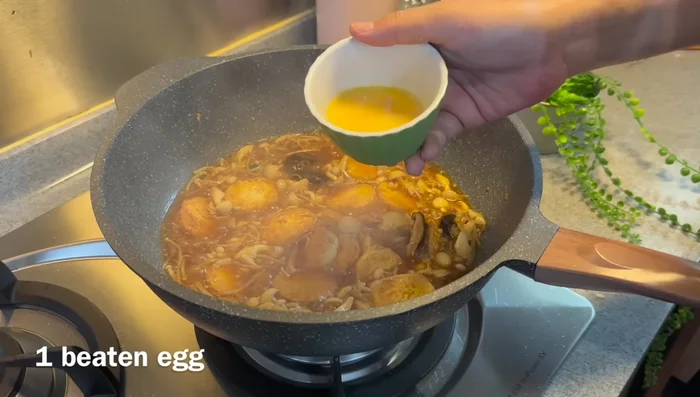 Stir in a beaten egg (optional).