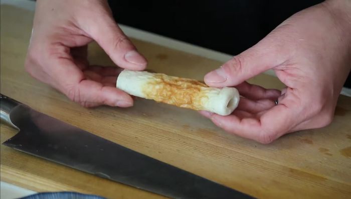 Cut the chikuwa fish cakes in half lengthwise. This prevents the batter from getting inside and remaining uncooked.