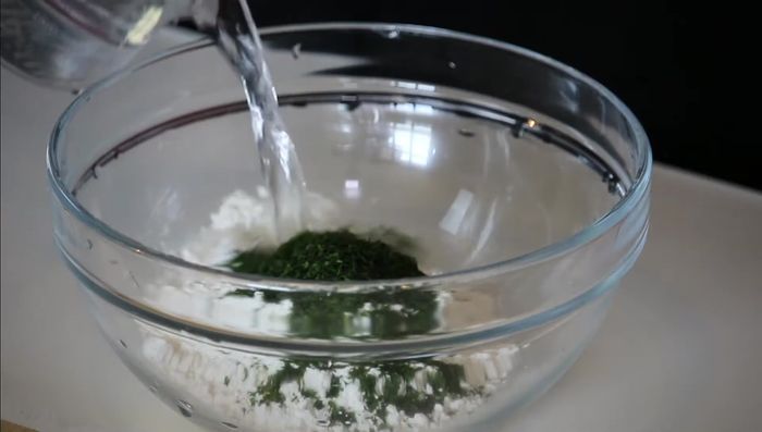 Gradually add cold water to the dry ingredients, mixing gently until just combined. Avoid overmixing to prevent the batter from becoming too sticky.