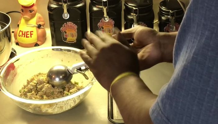 Using an ice cream scoop or spoon, form the fish mixture into patties.