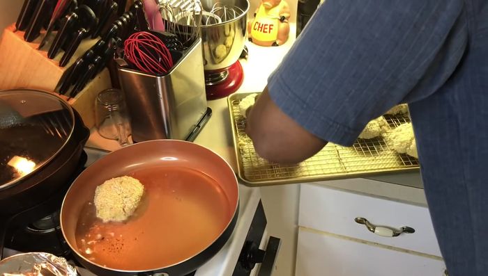 Carefully place breaded patties into a hot skillet with oil, ensuring not to overcrowd. Fry until golden brown on each side. You may need to finish cooking in the oven if the skillet cooks too quickly.