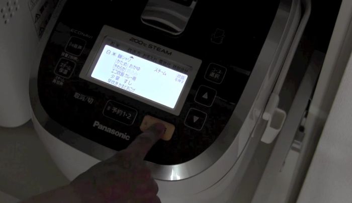 Press the rice cooker button to start cooking.