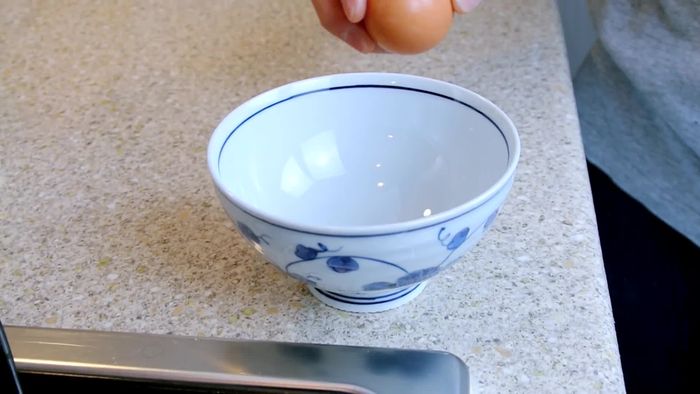 Crack the onsen tamago into a bowl.
