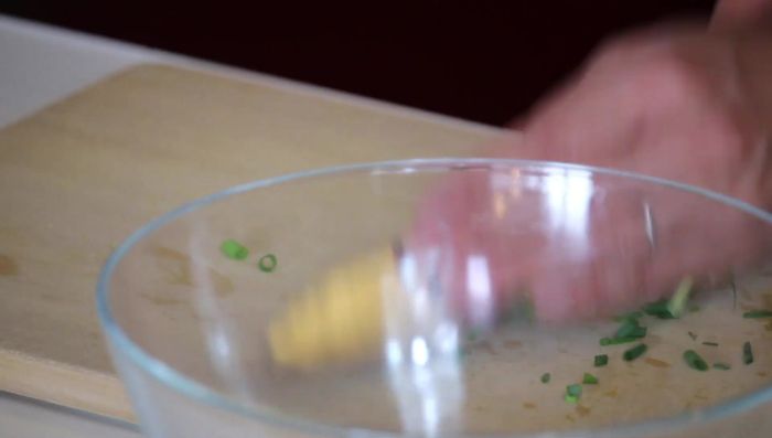 In a large bowl, combine eggs, crab sticks (torn into strips), and green onions. Add salt and pepper to taste.