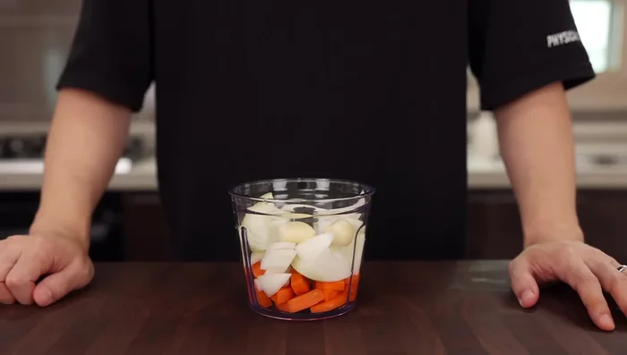 Blend the carrot, onion, garlic, and ginger until completely smooth. This helps extract more flavor faster.