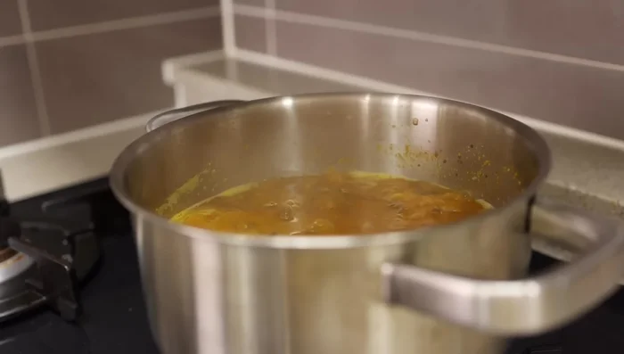 Bring the broth to a simmer over medium-low heat. Meanwhile, cook udon noodles according to package directions.