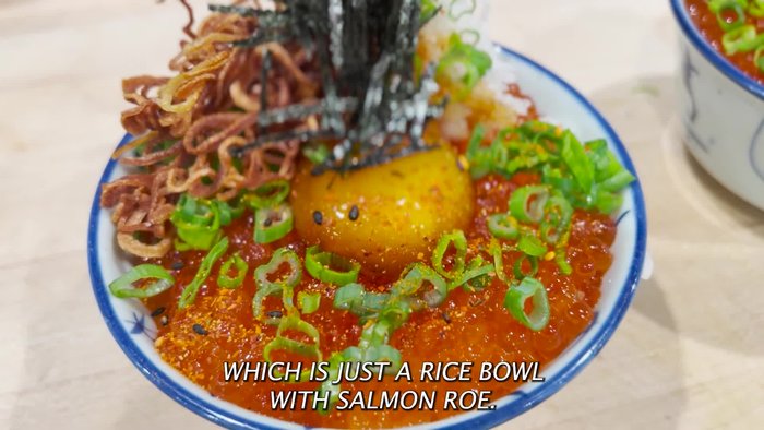 Add salmon to the rice bowl.