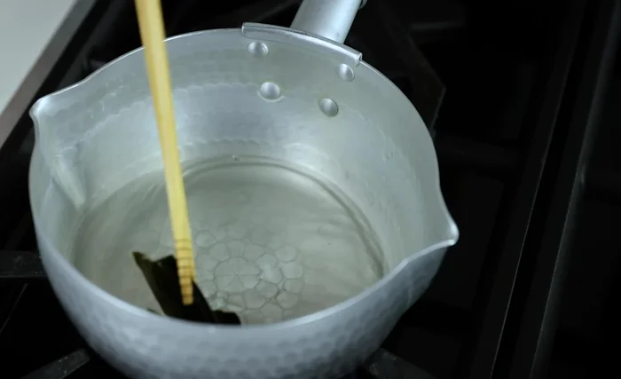 Drain the spinach: Remove the spinach from the boiling water and immediately transfer it to a colander to drain. Rinse under cold water to stop the cooking process and maintain its vibrant green color.