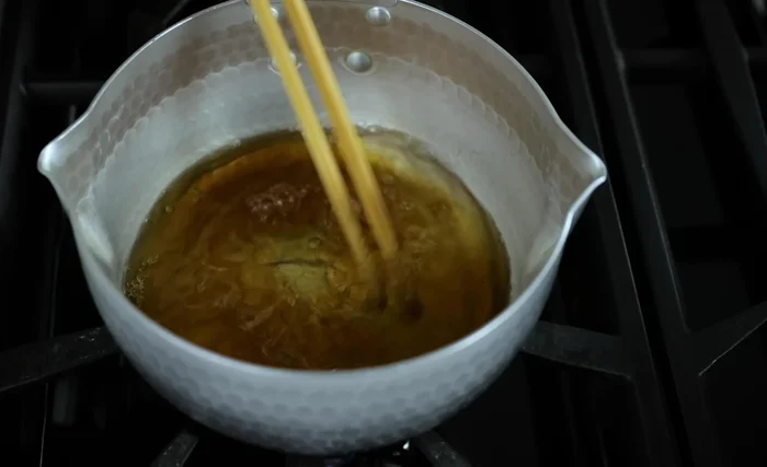 Squeeze out excess water: Gently squeeze out as much water as possible from the spinach. This step is crucial for preventing a watery salad.