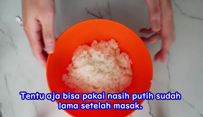 Shape the rice into onigiri using regular plastic. Keep the size small and manageable.