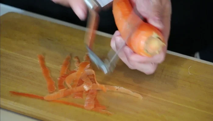 Prepare the vegetables: Peel and cut the carrot into bite-sized pieces (56.879). Peel and cut the potatoes into bite-sized pieces, removing any eyes (84.84). Peel and slice the onion (122.479). Remove the skin from the chicken thighs and cut them into bite-sized pieces (157.36).