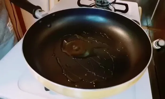 Add the chopped garlic and onion to the pan and sauté until the onion becomes translucent.