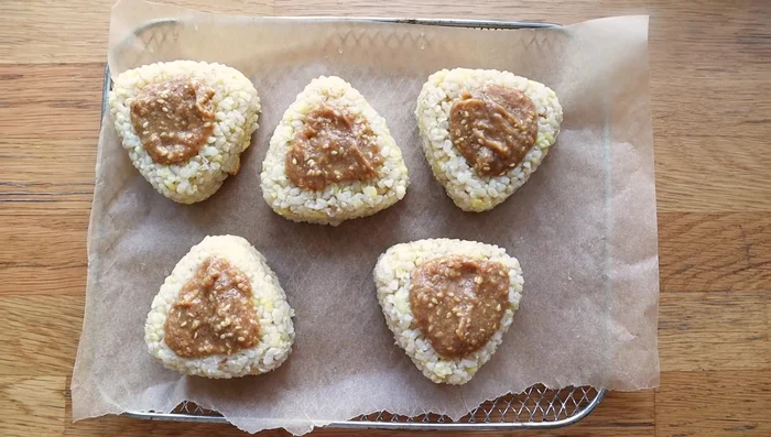 Grill or air fry the onigiri until crispy and slightly caramelized (507.539).