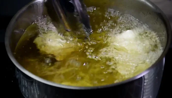 Drain the tofu: Once the tofu floats to the surface, cook for another 30 seconds. Remove and drain on a rack. (204.64)