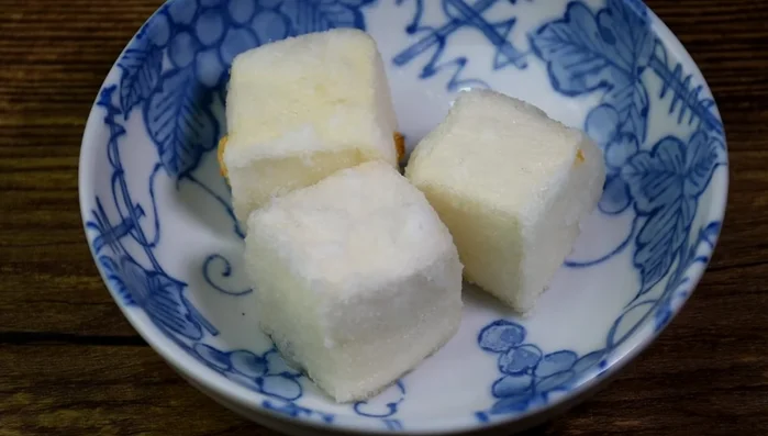 Assemble: Add the fried tofu to the dashi sauce. Garnish with spring onions, daikon radish, and additional bonito flakes. (213.95)