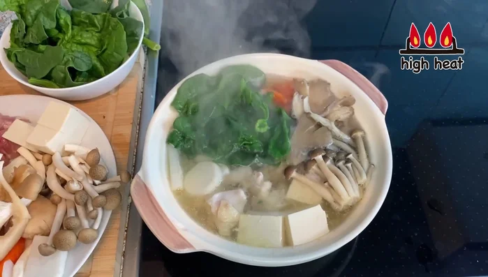 Once boiling again, add spinach.