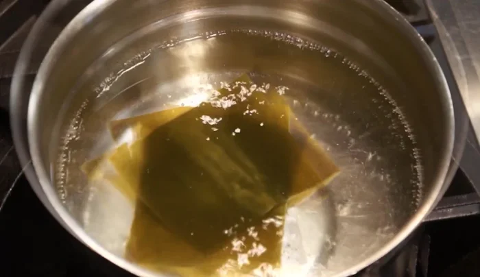 Make Dashi: Soak kombu in cold water for 2-4 hours (or overnight). Just before the water boils, remove the kombu. Bring the water to a boil, add katsuobushi, turn off the heat, and let it sit for 10 minutes. Strain the dashi.
