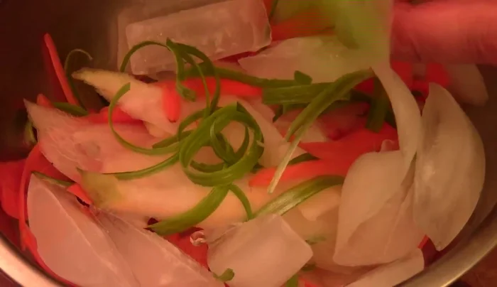 Pickle the sliced vegetables in sushi seasoning (or a mixture of vinegar, lime juice, and sugar) with ice cubes. Let sit for 15-20 minutes.