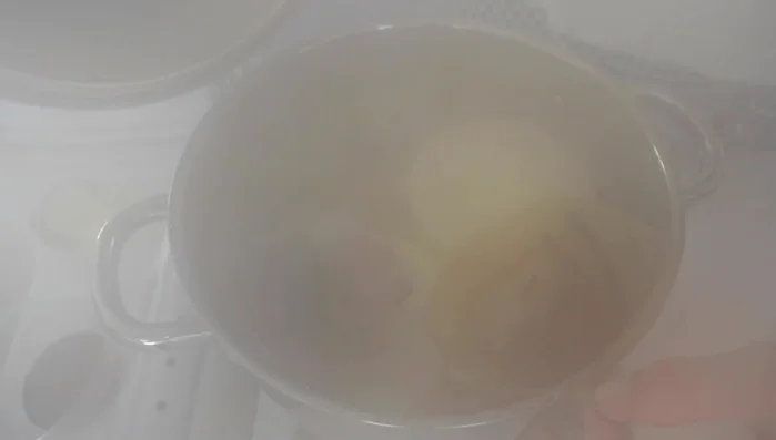 Add katsuobushi in a tea bag/filter to the dashi. Cook for 8 minutes to steep the umami. Remove the bag.