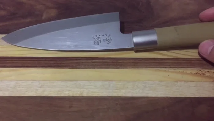 KAI Wasabi deba knife on wood
