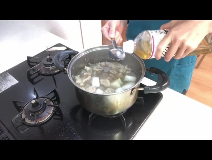 Add soy sauce and continue to simmer until the liquid reduces by half.