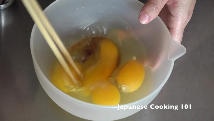 Heat a tamagoyaki pan (or small nonstick pan) at medium-high heat. Spread a thin layer of oil.
