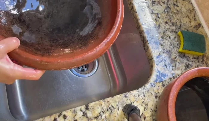 Boil water in pots: Fill the pots halfway with water and place them on a flame burner (NOT a ceramic or induction top). Let the water come to a slight boil for 30 minutes. (235.2)