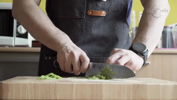 Santoku knife chopping vegetables