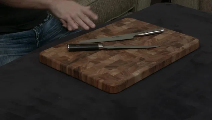 Shun and Global knives on cutting board