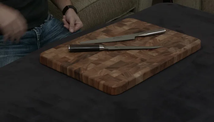 Shun and Global knives on cutting board