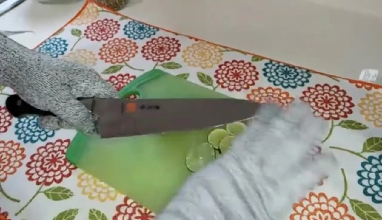 Mac knife slicing limes, sharp edge.