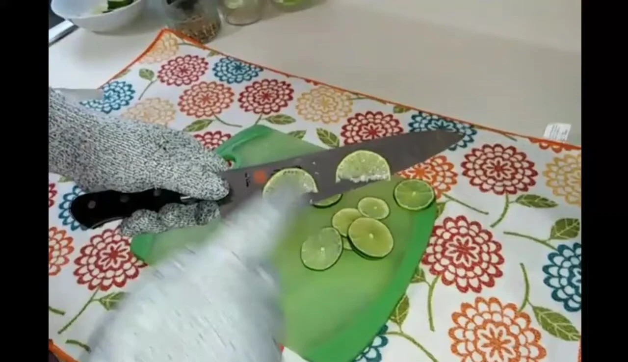 Mac knife slicing limes on board