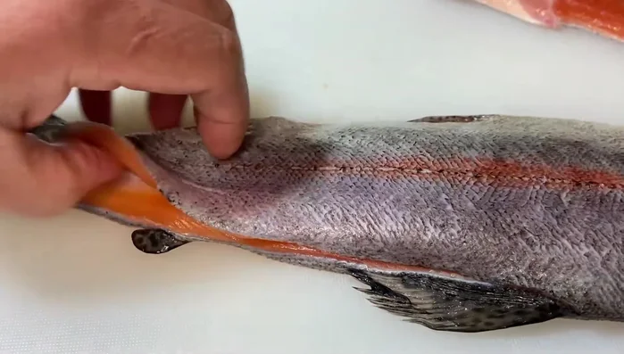 Filleting fish with a sharp knife