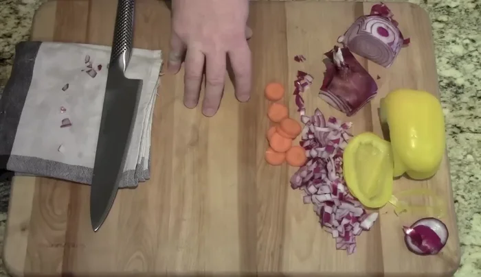 Sharp knife on wooden cutting board