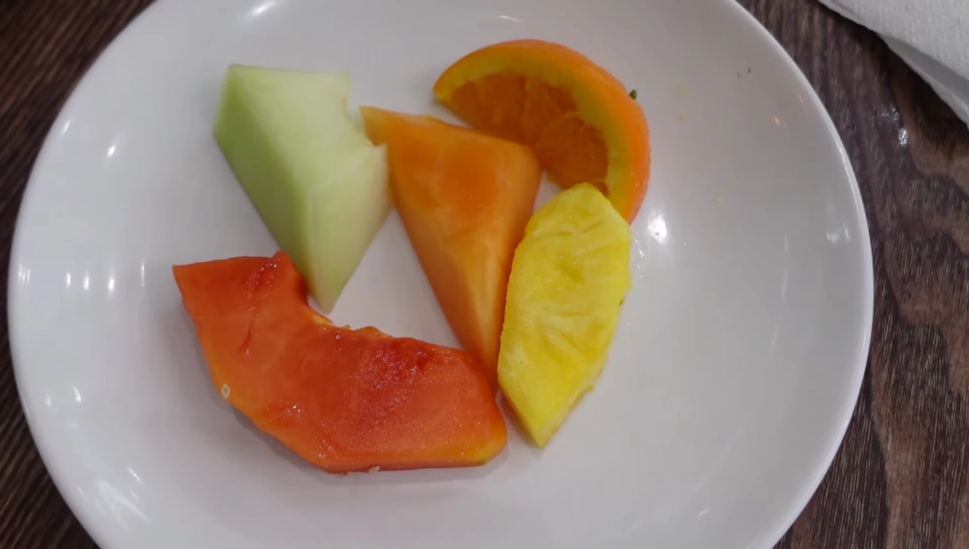 Fresh fruit dessert: papaya, cantaloupe, pineapple