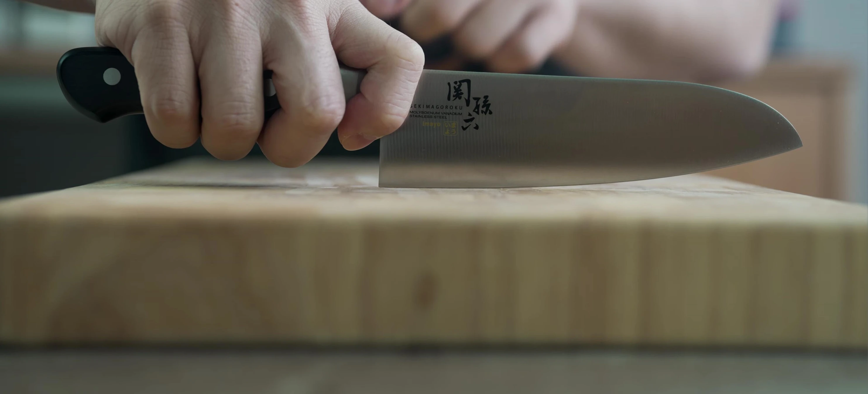 Santoku knife pinch grip, rocking motion.