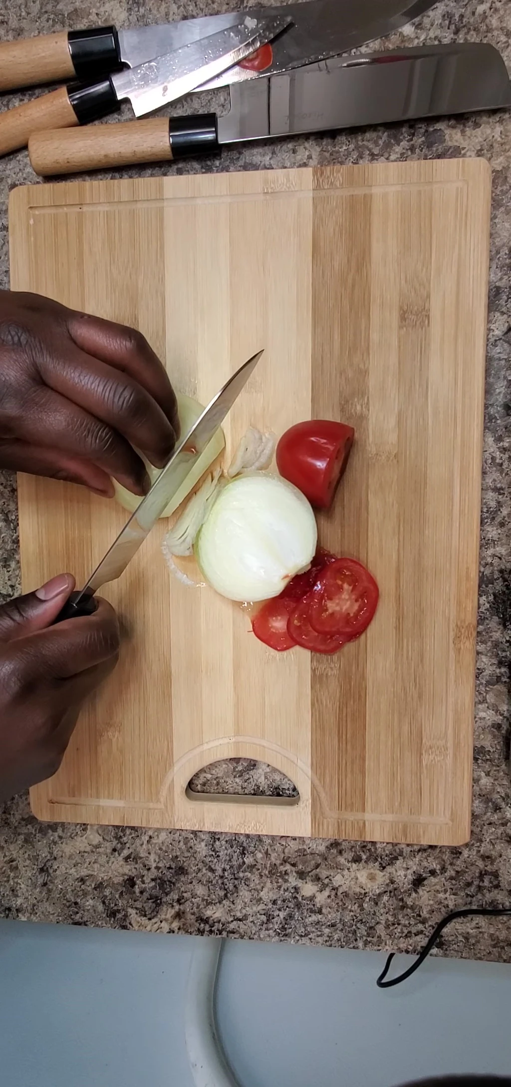 Hiruchi knife set slicing onion