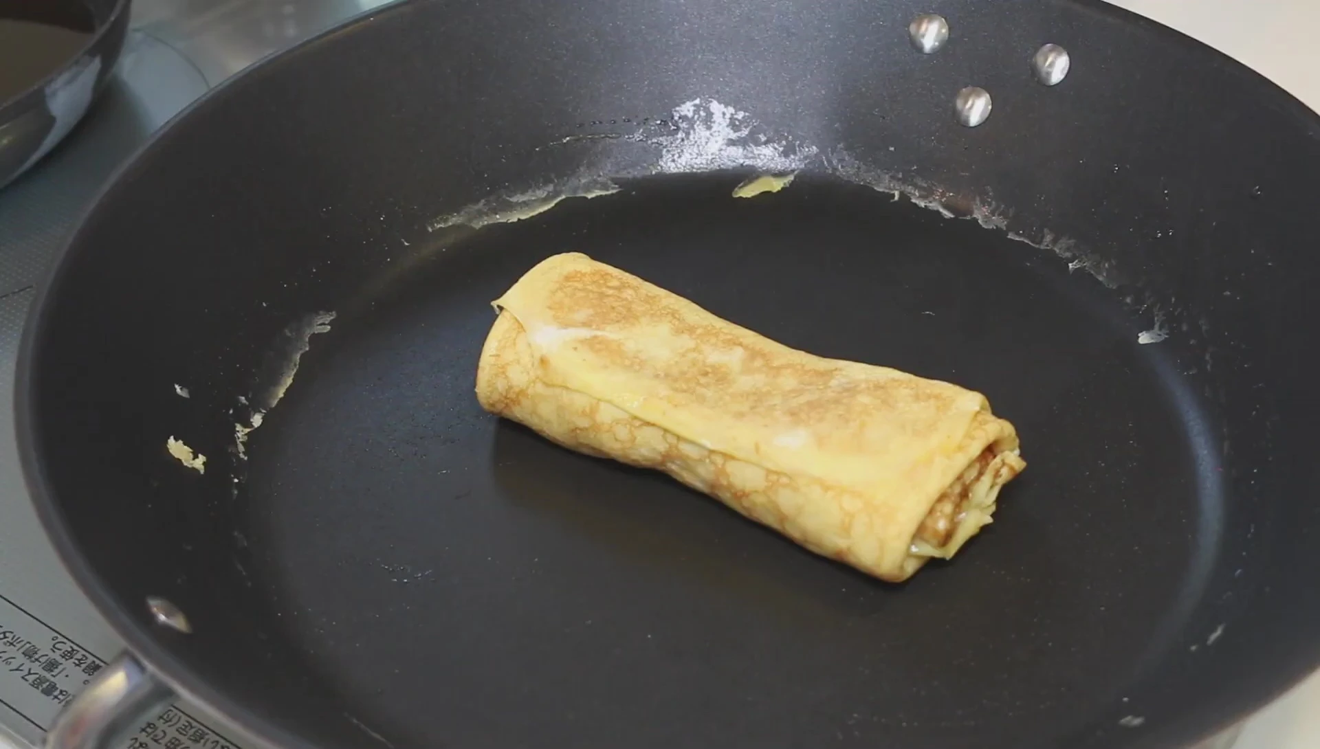 Tamagoyaki resting in a pan