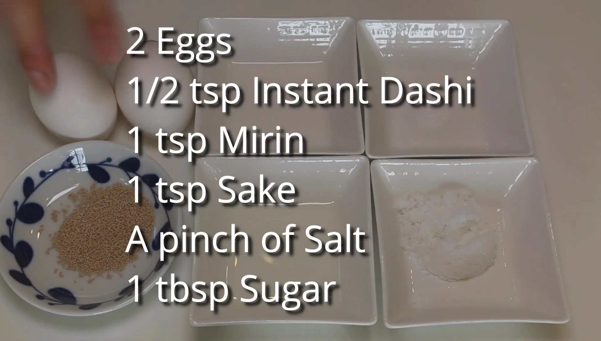 Tamagoyaki ingredients: eggs, dashi, mirin, sake, sugar, salt