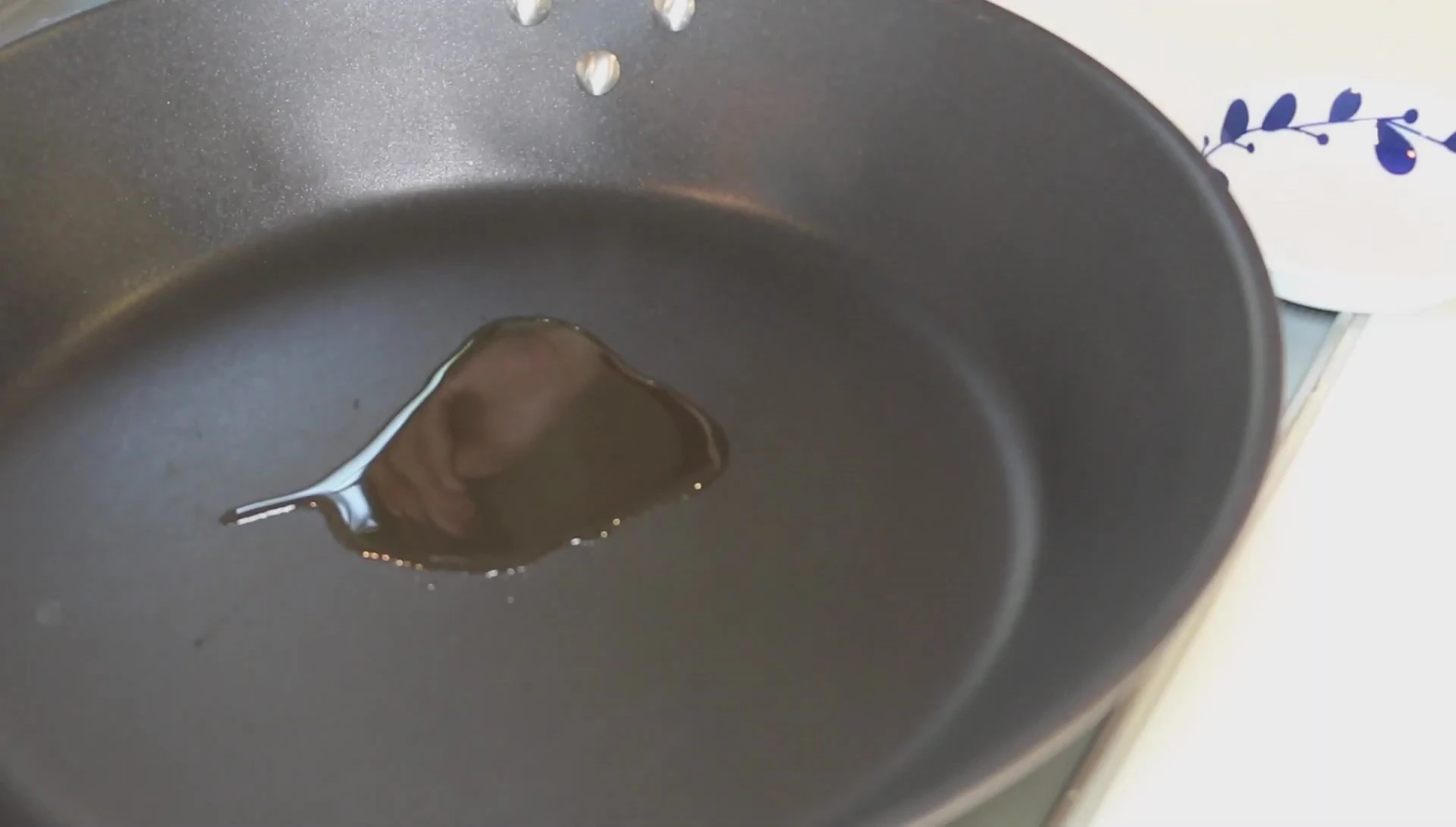 Oil in pan, preparing for omelette