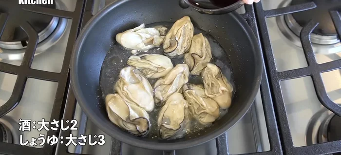 Once the oysters are plump, add sake and soy sauce. Continue cooking on low heat, ensuring the oysters remain juicy.