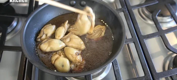 Remove the cooked oysters, reserving the cooking liquid. Wrap the oysters to keep them warm.