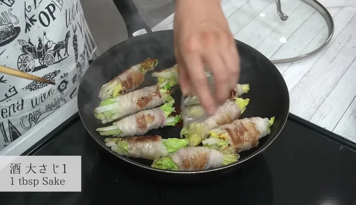 Pour sake over the cabbage, cover, and reduce heat to low. Steam for about 2 minutes.